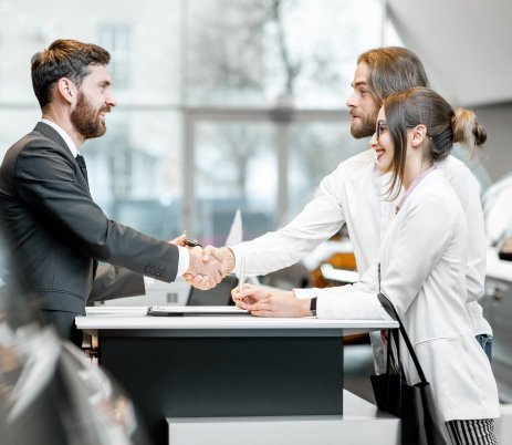 business couple at the stand with salesperson in t 2021 12 09 02 01 50 utc 1